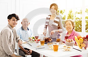 Asian family having dinnerÂ at home